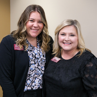 Photo of two female employees