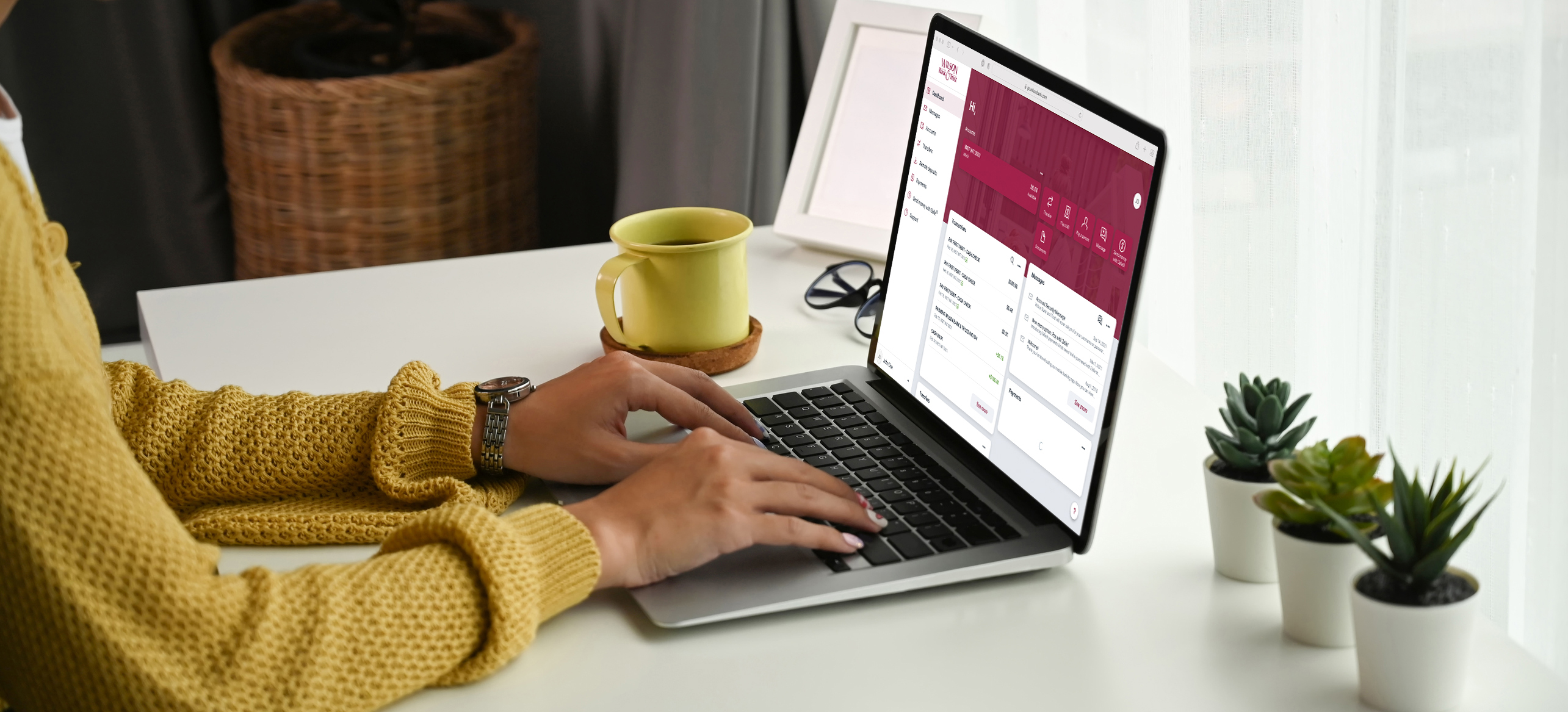 Person logging into online banking on their laptop.